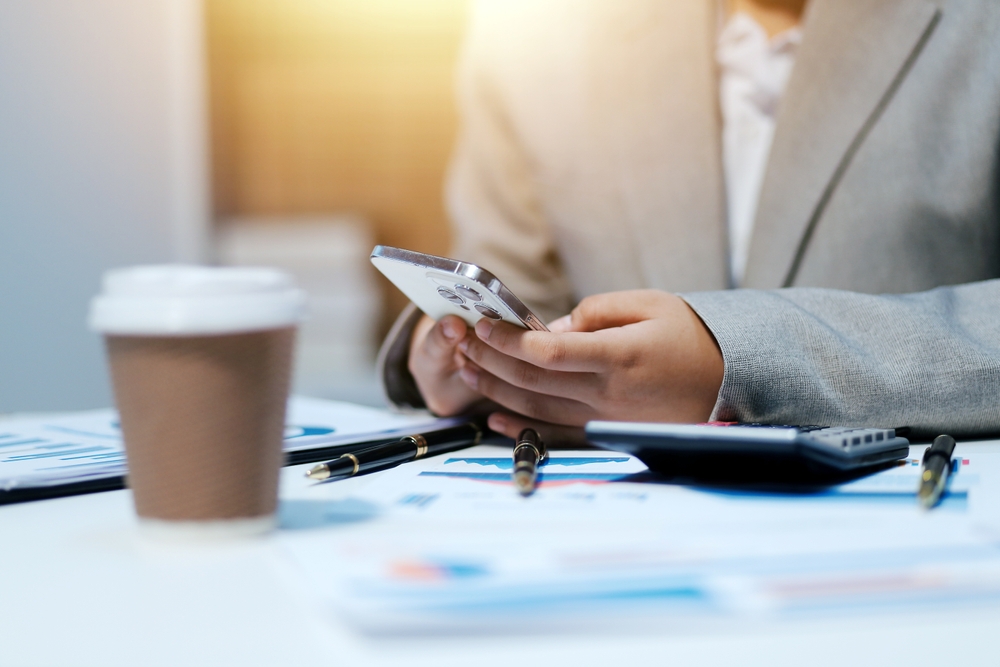 Business,Woman,Using,Calculator,And,Writing,Make,Note,With,Calculate.